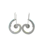 Close-up of Fireflys Spiral Sunburst Multi-Color Earrings, showcasing an artistic spiral design with inner cog-like details for an industrial look. Crafted with fair-trade practices, these silver earrings feature simple hooks for easy wear.