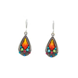 The Elegant Drop Multi-Color Earrings by Firefly feature teardrop-shaped, orange gemstones surrounded by smaller turquoise, green, red, and light blue stones. Handmade in Guatemala with hypo-allergenic materials, they include silver hooks and ornate metal detailing on a plain white background.