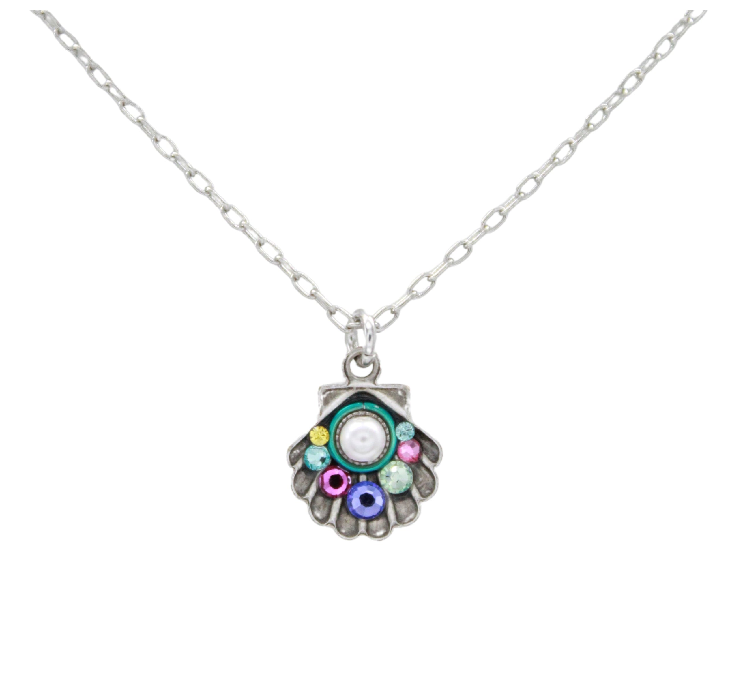 The Firefly Beach Pearl Shell Soft Necklace by Firefly features a scallop shell pendant with colorful gemstones and a central white stone, handmade in Guatemala and showcased on a white background.