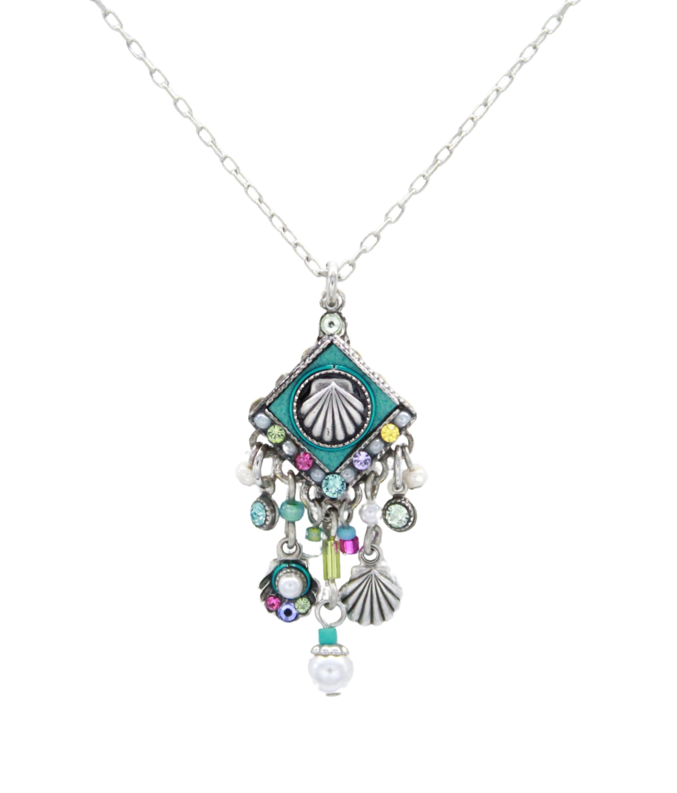 The Beach Pearl Diamond Shell w/Fringe Soft Necklace by Firefly features a shell pendant, turquoise accents, colorful beads, small shells, pearls, and fringe charms—handmade in Guatemala in Firefly’s signature style.