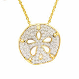 The Shanore Gold Vermeil Sand Dollar Necklace, from the Ocean Jewelry collection, showcases a sand dollar-shaped pendant with glittering cubic zirconia. This intricately designed piece has a cut-out texture and hangs elegantly on a delicate chain.