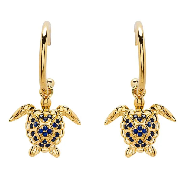 Shanores Gold Vermeil Blue and White Sapphire Turtle Earrings feature detailed designs with dangling charms adorned with lab-grown sapphires, enhancing the intricate allure of ocean jewelry.