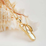 The Shanore Gold Vermeil Mother of Pearl Flip Flop Necklace features a sleek pendant design on a delicate chain. The textured shell background beautifully reflects light, enhancing its polished surface and adding elegance to any ensemble.