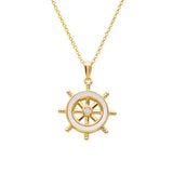 The Shanore Gold Vermeil Mother of Pearl Ship Wheel Necklace features a ships wheel pendant with a round center crystal resembling mother of pearl and comes with a delicate matching gold-tone chain.