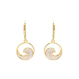 The Shanore Gold Vermeil Ocean Wave Earrings feature a circular swirl adorned with white cubic zirconia stones, complete with a dangling hook attachment for an elegant sparkle reminiscent of ocean waves.