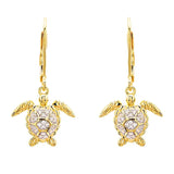 Shanores Gold Vermeil Turtle Drop Earrings, from the Ocean Jewelry collection, feature delicate gold hooks paired with sparkling cubic zirconia against a white backdrop.