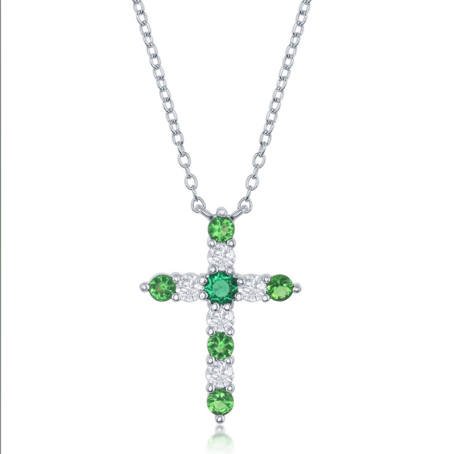 The Classic of New York Sterling Silver Birthstone Cross (May) Necklace features alternating round green and clear stones, making it an elegant emerald or May birthstone jewelry piece, shown on a white background.