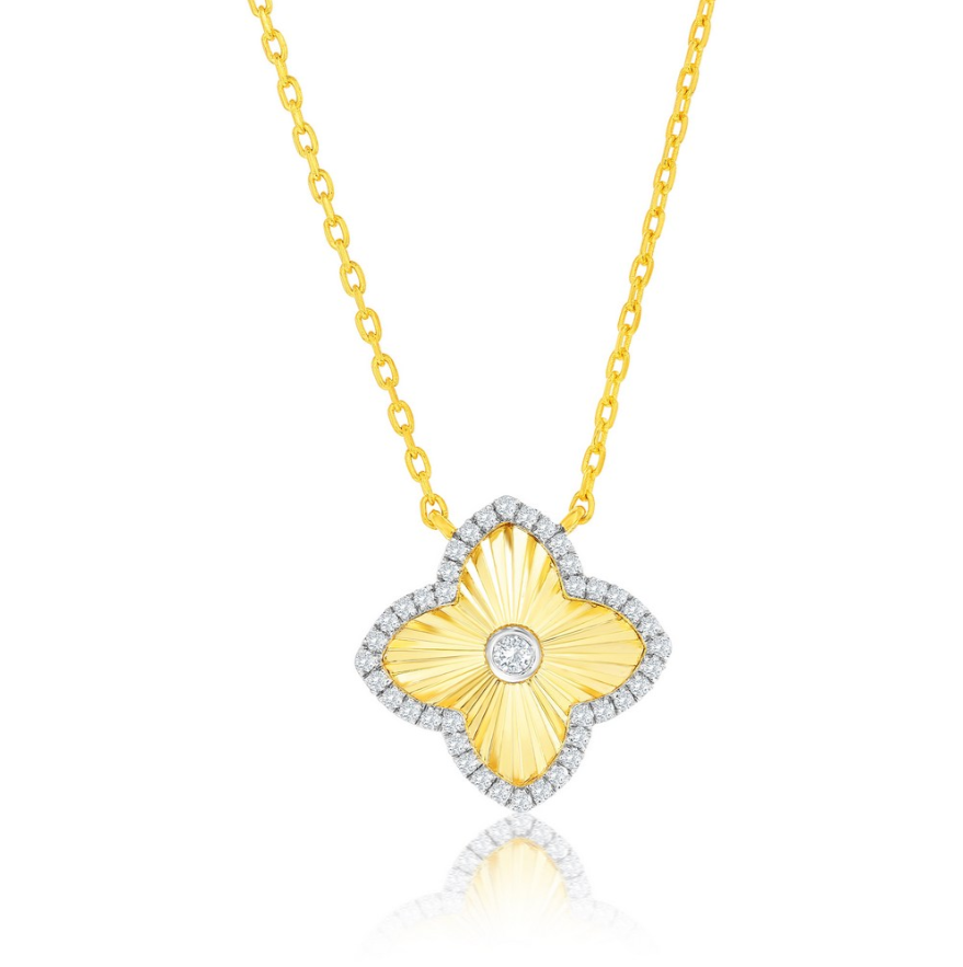 The Gold Plated Clover CZ Outline Necklace by Classic of New York features a clover-shaped yellow pendant with a textured finish, CZ accents along the edge, and a central round diamond.