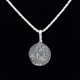 A sterling silver necklace with a twisted chain and circular pendant echoes the Lima 8 Escudo Coins design with an ancient coin motif on a black background, from Lima 8 Escudo Coin - Atocha Shipwreck Coins (Pendant Only) by The Treasure Shoppe Inc.