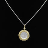 A silver necklace features a round coin pendant with an ornate gold-plated rope bezel and embossed center design, set against a black background, from The Treasure Shoppe Inc.s Gold Plated Rope Bezel Coin - Atocha Shipwreck Coins collection.