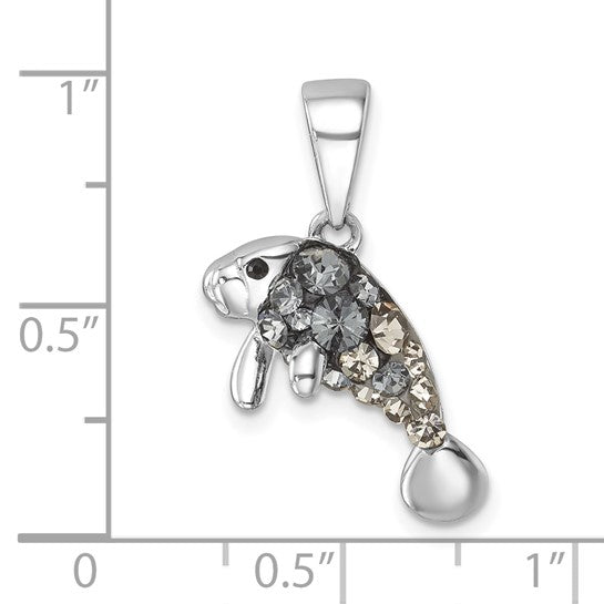 The Presco/Quality Gold Crystal Manatee Pendant, featuring sparkling Swarovski crystal and gray rhinestones in sterling silver, is shown against a ruler displaying inch measurements.