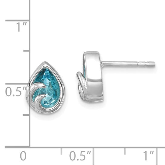 The Presco/Quality Gold Crystal Aqua Wave Post Earrings feature teardrop-shaped blue gemstones in sterling silver, with a swirl design on one side. Each earring measures about 0.5 inches and is displayed on a grid background.