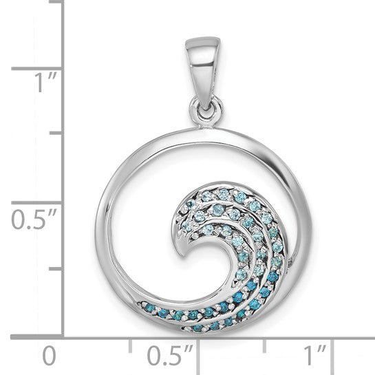 The Presco/Quality Gold Crystal Medium Blue Wave Pendant is a sterling silver piece with a wave design set with blue and clear gemstones, measuring about 1 inch in diameter.