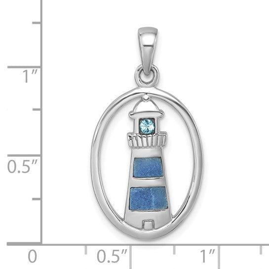The Presco/Quality Gold Crystal Lighthouse Pendant features blue accents in an oval sterling silver frame. Shown on a white background with a measurement grid, it measures just over 1 tall and about 0.75 wide.