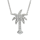 The Shanore Swarovski Crystals White Palm Tree Necklace-Ocean Jewelry features a sterling silver palm tree, sparkling with Swarovski crystals, elegantly centered on a delicate chain against a white background.