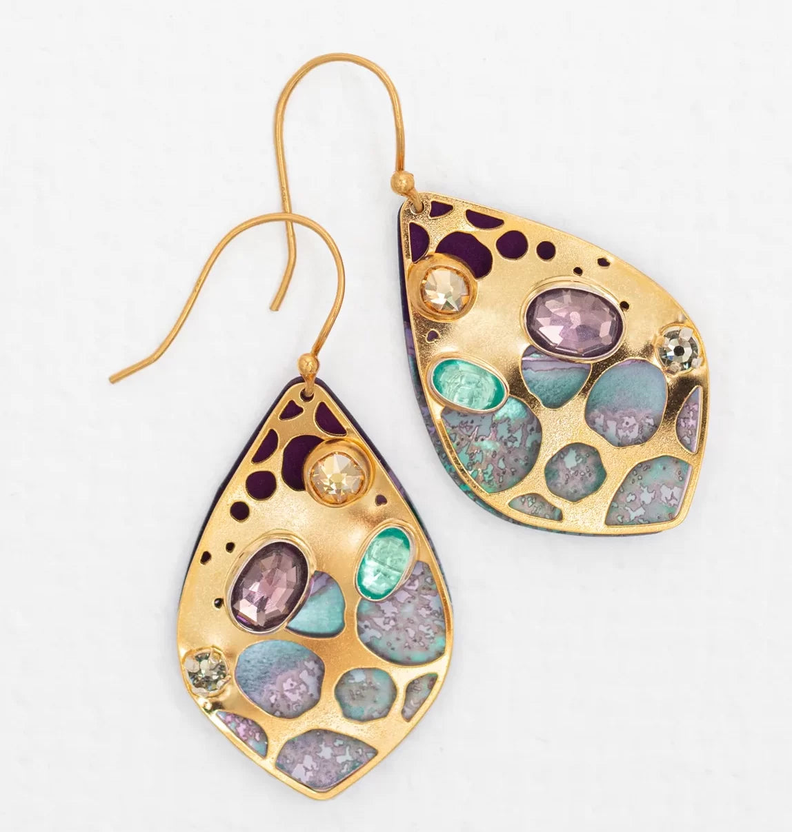 The Seashore Dreams Purple Earrings by Holly Yashi feature teardrop-shaped gold designs with Austrian crystals in purple, turquoise, aqua, and yellow. Hanging from thin gold hooks, they offer an elegant bohemian glass aesthetic.