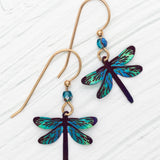 The Turquoise Dragonfly Dreams Earrings by Holly Yashi feature two earrings with colored niobium gold hooks, vibrant teal and blue dragonfly charms, and small blue beads. Designed to be hypo-allergenic for everyone.
