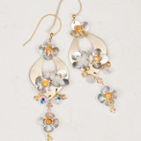 Holly Yashi’s Hawaiian Wedding Gold/Silver Earrings feature gold hooks, metallic floral shapes, iridescent beads, and shimmering flower accents—perfect for a gorgeous wedding look.