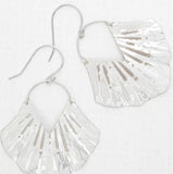 The Silver Ariel Earrings by Holly Yashi feature textured silver with scalloped edges and an abstract hammered ocean-inspired design. Hypo-allergenic and dangle-style, they include hook attachments and are showcased against a white background.