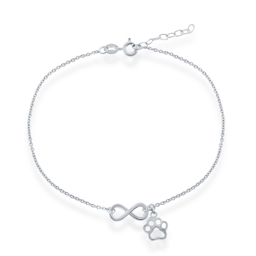 The Sterling Silver Infinity & Paw Print Anklet by Classic of New York features an adjustable chain, lobster clasp, and delicate charms—a central infinity symbol and a small paw print.