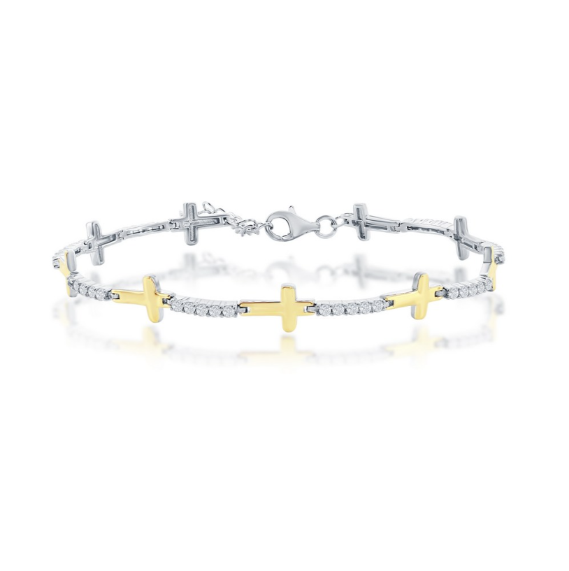 The Gold Plated CZ Sideways Cross Bracelet by Classic of New York features alternating yellow gold plated and sterling silver cross links, sparkling white stones, and a secure lobster clasp.