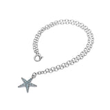 The Shanore Swarovski Crystals Starfish Aqua Anklet-Ocean Jewelry features a sterling silver chain with a star-shaped pendant adorned with light blue gemstones, displayed on a white background to highlight its delicate design and the crystals sparkle.