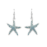 The stunning Shanore Swarovski Crystals Starfish Aqua Earrings from the Ocean Jewelry collection feature starfish-shaped designs with shimmering crystals. Each symmetrical starfish dangles elegantly from delicate hooks, creating a striking effect against a plain white background.
