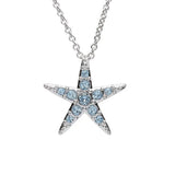 The Shanore Swarovski Crystals Medium Aqua Starfish Necklace is a captivating piece of ocean jewelry. Its elegant silver pendant, adorned with aquamarine crystals, glistens beautifully with light blue gemstones on a delicate chain.