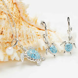 Explore Shanores Swarovski Crystals Aqua Turtle and Pearl Necklace, part of our ocean-inspired jewelry collection. Featuring light blue gemstones, seashells, and pearls, this elegant piece perfectly blends beach charm with sophistication.