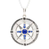 Shanores Swarovski Crystals Mother of Pearl Blue Sapphire Compass Necklace from the Ocean Jewelry collection features a silver compass rose pendant with vibrant gemstones and encircled cardinal directions, making it an elegant accessory for any journey.