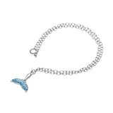 The Shanore Swarovski Crystals Aqua Mermaid Tail Anklet-Ocean Jewelry boasts a sterling silver chain with a mermaid tail pendant, embellished with blue Swarovski crystals, and secured with a simple clasp.