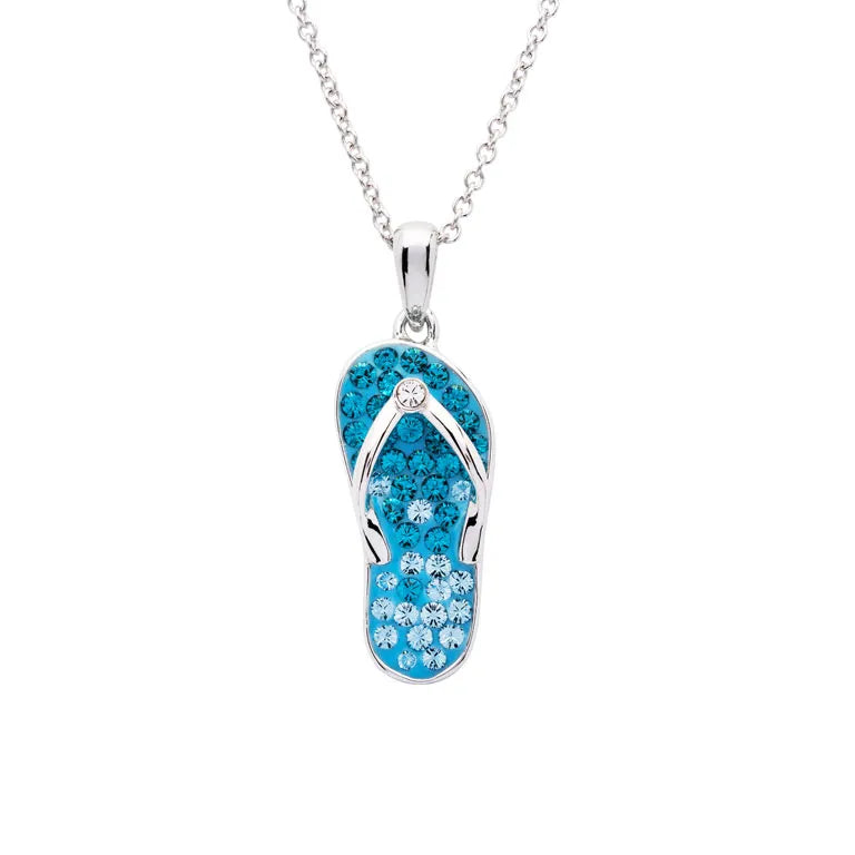 Discover Shanores Swarovski Crystals Aqua Flip Flop Necklace—Ocean Jewelry. This stunning piece captures beachy vibes with its flip-flop pendant, adorned with dazzling blue and clear crystals on a sleek silver chain, reminiscent of sparkling waters.