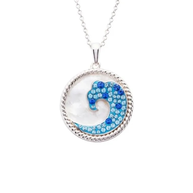 Shanores Swarovski Crystals Mother of Pearl Wave Necklace showcases a circular pendant with a wave motif, embellished with sparkling Swarovski crystals and framed by a rope-like border. It elegantly hangs on a delicate silver chain, adding elegance to any collection.