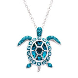 Shanores Swarovski Crystals December Birthstone Turtle Necklace from Ocean Jewelry features a silver pendant with dazzling blue crystals. The sparkling shell and flippers create a stunning effect, making it ideal for fans of December birthstones.