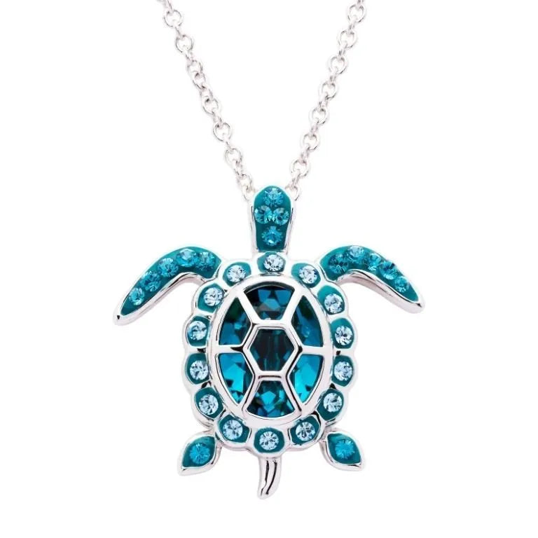 Shanores Swarovski Crystals December Birthstone Turtle Necklace from Ocean Jewelry features a silver pendant with dazzling blue crystals. The sparkling shell and flippers create a stunning effect, making it ideal for fans of December birthstones.