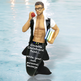The December Diamonds Hot 4 Teacher Ornament features a merman with glasses, holding an apple and books, wearing an open shirt, and sporting a chalkboard tail inscribed “Erasable Chalkboard Paint... Write your own personal Message.”.
