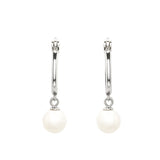 The Sterling Silver Pearl Hoop Earrings-Ocean Jewelry by Shanore features two silver hoops with dangling freshwater pearls, offering elegance on a white background. Hypo-allergenic and ideal for sensitive skin, these earrings blend style with comfort perfectly.