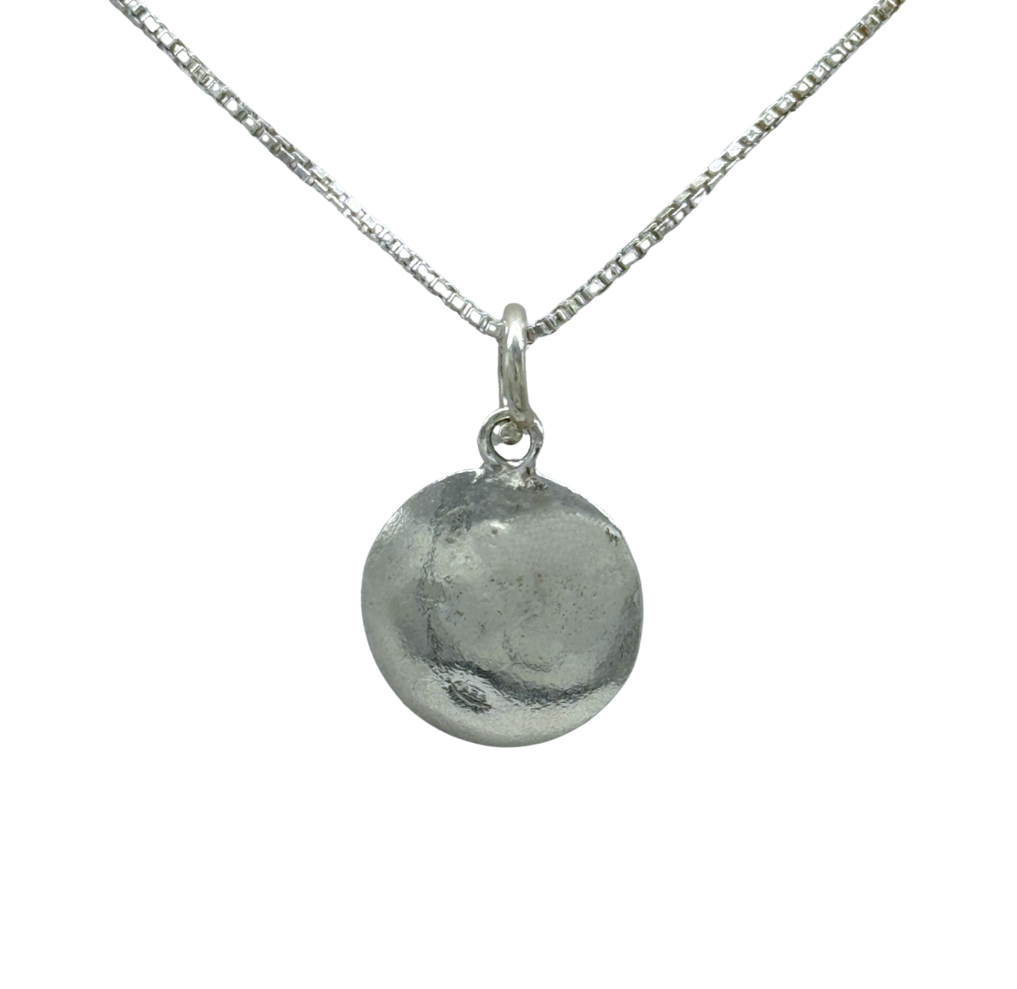 The Fresh Water Pearl in Oxidized Silver Disc Necklace by Mediterranean Artists Co. Sterling Silver features a round, lightly textured oxidized silver pendant with a freshwater pearl on a delicate chain against a white background.