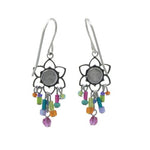 Fireflys Light Medium Flower Multi-Color Earrings feature handmade silver flower shapes with circular centers. Each petal has a dangling thread adorned with colorful beads in purple, green, blue, orange, and pink. Crafted using fair-trade practices for ethically stylish wear from Firefly Jewelry.
