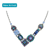 Discover the La Dolce Vita V Light Blue Necklace by Firefly Jewelry, a dazzling new arrival handmade in Guatemala. Featuring circular and square geometric gemstone pendants with blue and multicolored gems, this stylish piece is elegantly adorned with a turquoise badge for its authenticity.