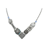 Introducing the Firefly La Dolce Vita V Light Blue Necklace, a stunning handmade piece from Guatemala featuring silver with textured circular, rectangular, and floral motifs linked by small blue beads. This hypo-allergenic accessory ensures both style and comfort.