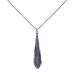 This fair-trade Firefly jewelry piece, the Large Gazelle Red Drop Necklace, features a silver necklace with a feather-shaped pendant. Meticulously handmade in Guatemala, its intricate engravings add texture while the delicate chain enhances its elegance.