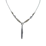 The Linear Y Multi-Color Necklace by Firefly Jewelry, handmade in Guatemala, showcases intricate leaf-shaped links with a central dangling feather pendant.