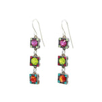 Introducing the Rainbow Square Multi-Color Earrings by Firefly Jewelry: these dangle beauties feature three square segments with vibrant pink, green, and orange gemstones set in silver-tone metal. These fair-trade treasures embody handcrafted ethical elegance with delicate colored accents.