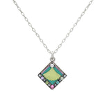 The Firefly Beach Glass Diamond Soft Necklace features a silver chain with a diamond-shaped pendant adorned in colorful enamel—green, yellow, blue, pink, purple—beach glass hues, and small round gemstones along the edges.