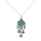 The Firefly Playa Starfish Fringe Soft Necklace features a silver chain with a turquoise diamond pendant, starfish, and playful purple, green, and blue charms. Beautifully handmade in Guatemala by Firefly Jewelry.