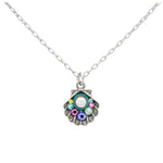 The Firefly Beach Pearl Shell Soft Necklace by Firefly features a scallop shell pendant with colorful gemstones and a central white stone, handmade in Guatemala and showcased on a white background.