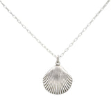 The Firefly Beach Pearl Large Shell Soft Necklace features a handmade, textured large shell pendant on a delicate silver chain, crafted in Guatemala by Firefly Jewelry and shown against a simple white background.