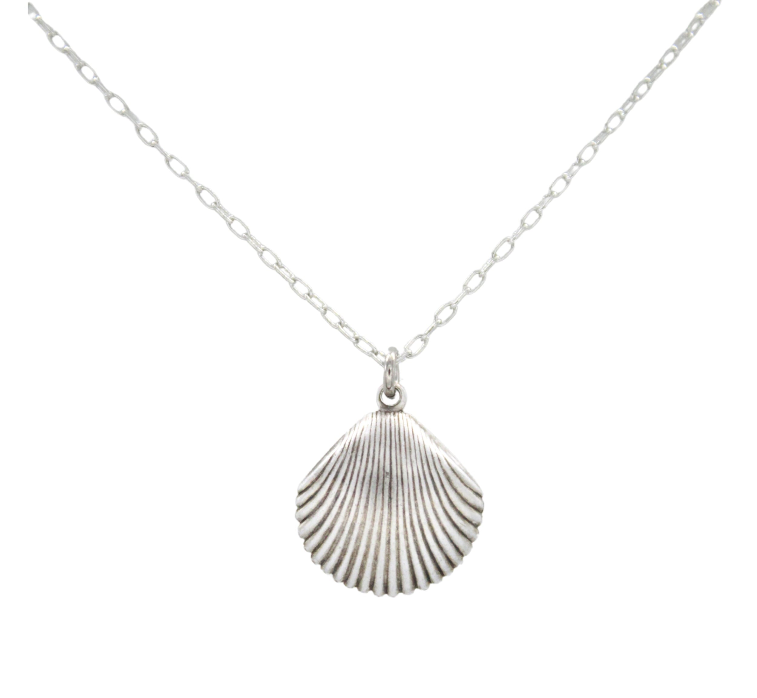 The Firefly Beach Pearl Large Shell Soft Necklace features a handmade, textured large shell pendant on a delicate silver chain, crafted in Guatemala by Firefly Jewelry and shown against a simple white background.