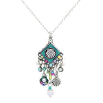 The Beach Pearl Diamond Shell w/Fringe Soft Necklace by Firefly features a shell pendant, turquoise accents, colorful beads, small shells, pearls, and fringe charms—handmade in Guatemala in Firefly’s signature style.